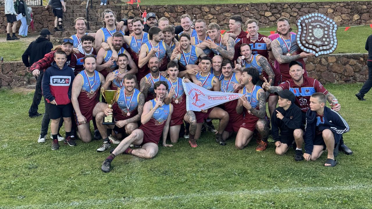 League premiers 2025 with the cup and shield